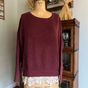 Pins and needles maroon sweater with lace trim at the bottom.